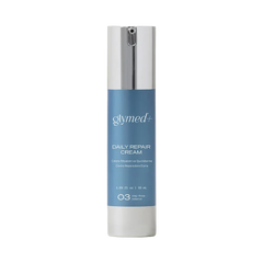 A cylindrical skincare bottle labeled 'glymed+' and 'daily repair cream' with a blue label and silver cap, centered on a light gray background.